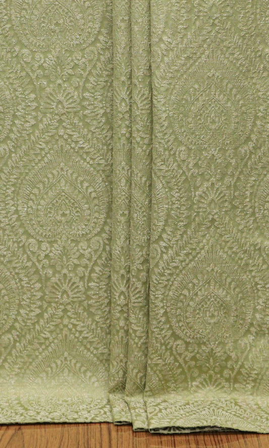 Pistachio green damask patterned drapery